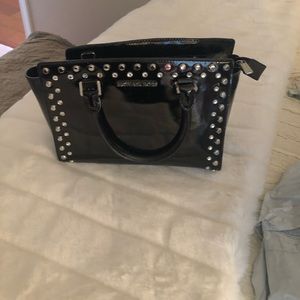 MK studded small Selma black patent